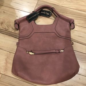 Rose colored liberated leather handbag